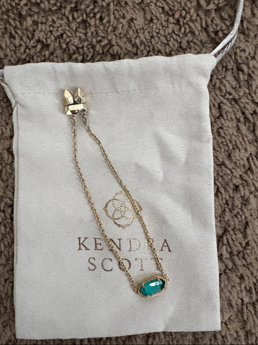 Kendra Scott Gold bracelet with Teal Stone Pendant